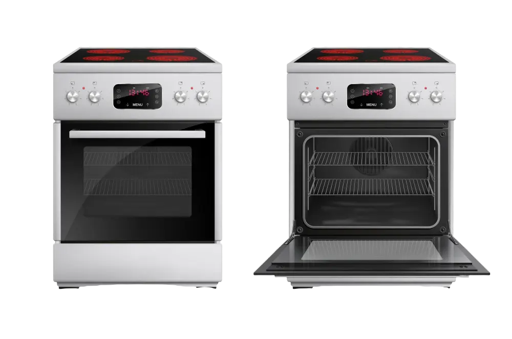 Técnico de mantenimiento reparando un horno en una cocina de Madrid, utilizando herramientas profesionales para garantizar la seguridad y eficiencia del electrodoméstico.